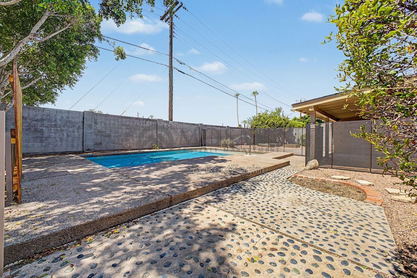 Sunshine, splashing, and a backyard built for it! property image